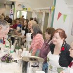 Attendees enjoying tea, coffee and cakes at Woodley's World War One Centenary Memorial event